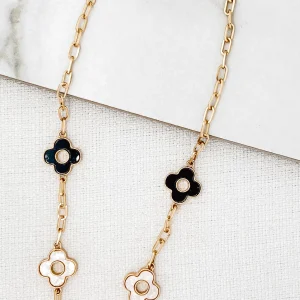 Short gold necklace with black and white fleurs